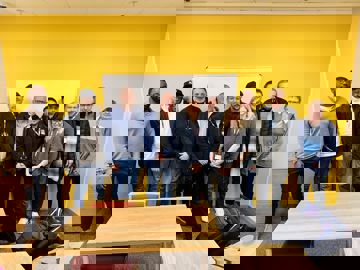 Group photo of customers and colleagues at the Lighthouse Project